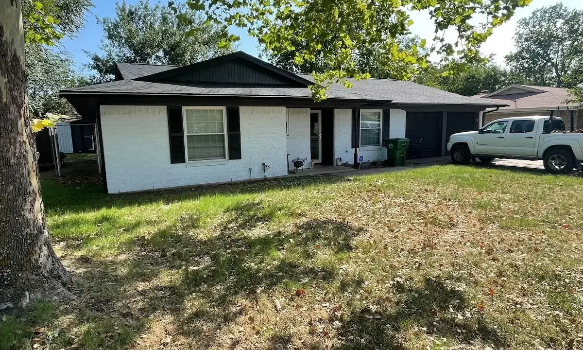 Professional roofing crew working on a residential roof in Wareham